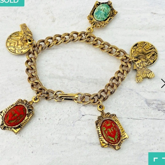 Vintage Jewelry - Vintage Egyptian revival Czech glass pharoah
Face charm bracelet Bracelet